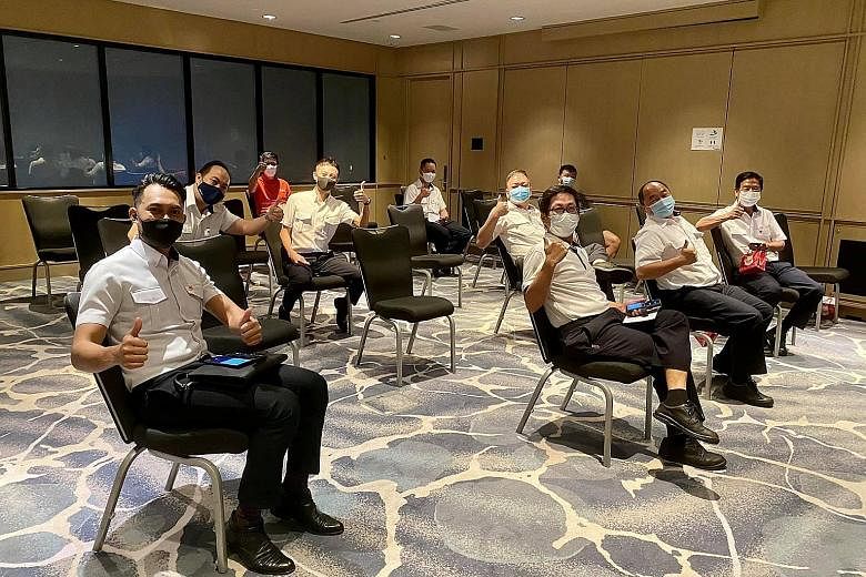 Harbour pilots from PSA took their vaccinations at Raffles City Convention Centre yesterday afternoon. The SafeEntry@Sea platform will be introduced at piers, such as Marina South Pier and West Coast Pier.