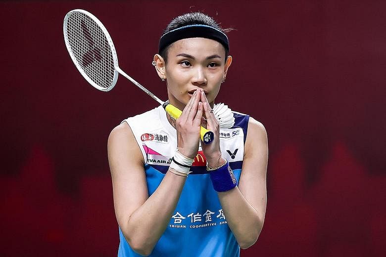 Tai Tzu-ying performing the wai greeting after beating Kim Ga-eun at the Yonex Thailand Open. The Taiwanese shuttler will next face Michelle Li in the quarter-finals. PHOTO: AGENCE FRANCE-PRESSE