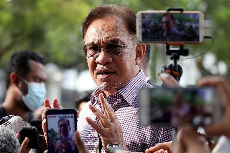 Malaysia's opposition leader Anwar Ibrahim says existing measures such as the movement control order were sufficient to control the spread of Covid-19. PHOTO: REUTERS