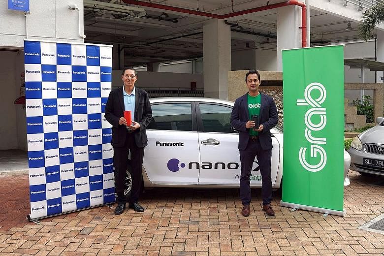 Panasonic Singapore managing director Paul Wong (left) and GrabAds Singapore head Meru Shantharam with the nanoe X generators.
