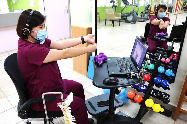 Alexandra Hospital senior physiotherapist Tan Ee Leng demonstrating a wrist-stretching exercise during a virtual consultation with a patient last year. In the wake of the widespread adoption of video-conferencing tools like Zoom since the pandemic st