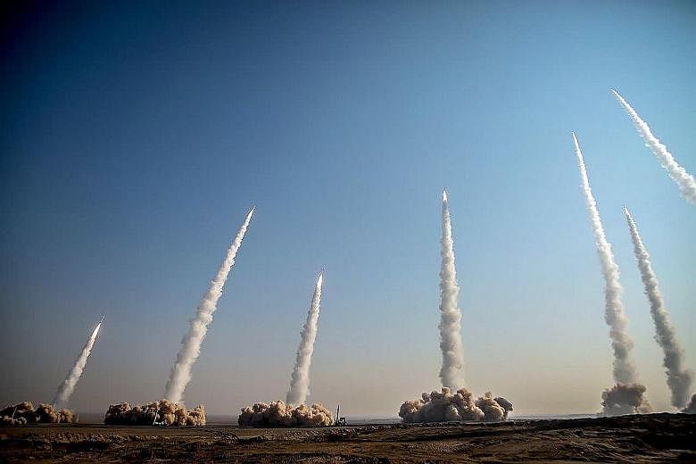 Missiles being launched during the drill by Iran's Revolutionary Guards. The military exercise was Iran's third in less than two weeks, and comes amid rising tensions with the US.