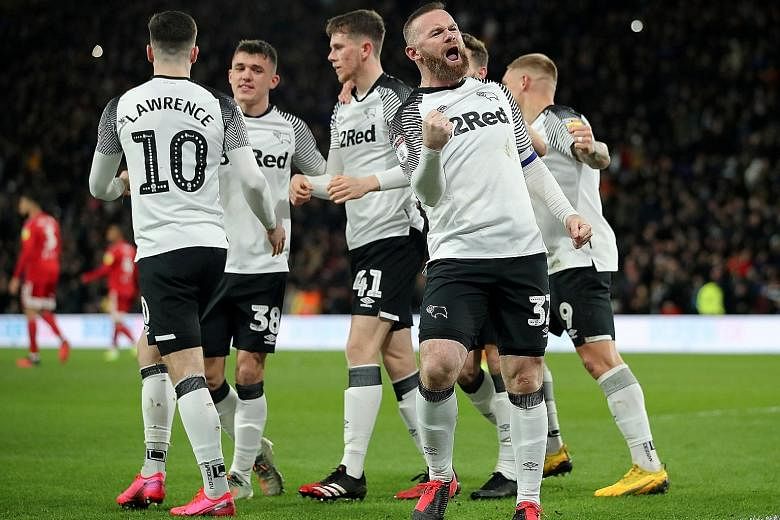 Wayne Rooney celebrating after a Derby County goal last February. He was the interim boss since Dutchman Phillip Cocu's sacking in November and has now signed a 2 1/2-year deal.