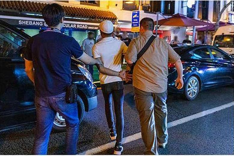 An individual being detained during a two-week islandwide operation from Dec 21 to Jan 3, in which a total of 151 people were arrested. A police spokesman said that the number of arrests last year was significantly lower due to Covid-19 movement rest