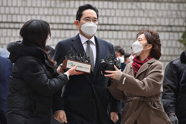 Samsung Electronics vice-chairman Lee Jae-yong arriving at court in Seoul yesterday. The Seoul High Court found him guilty of bribery, embezzlement and concealment of criminal proceeds worth about 8.6 billion won (S$10.35 million). PHOTO: AGENCE FRAN
