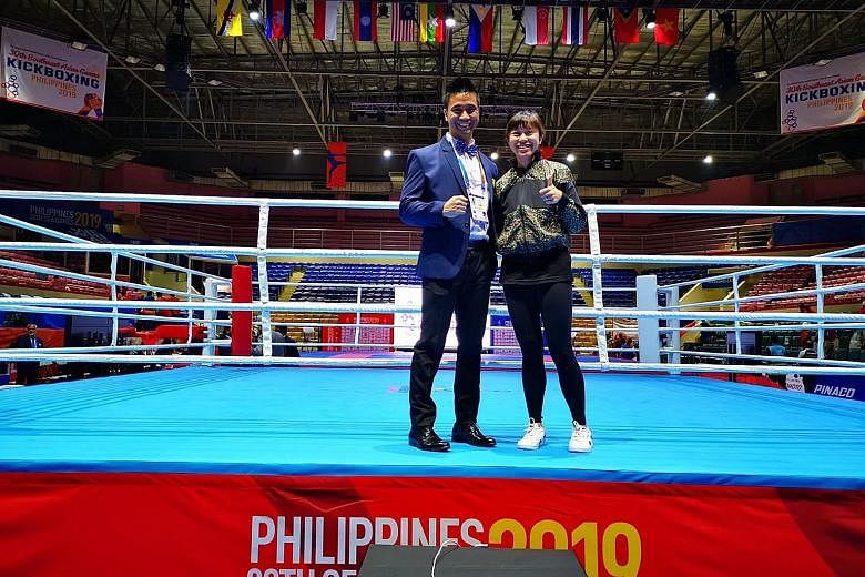 Kickboxing Federation of Singapore vice-president Joel Lye and general secretary Valencia Yip at the 2019 SEA Games in the Philippines. Both officials have been handed three-year bans by the Asian Kickboxing Confederation.