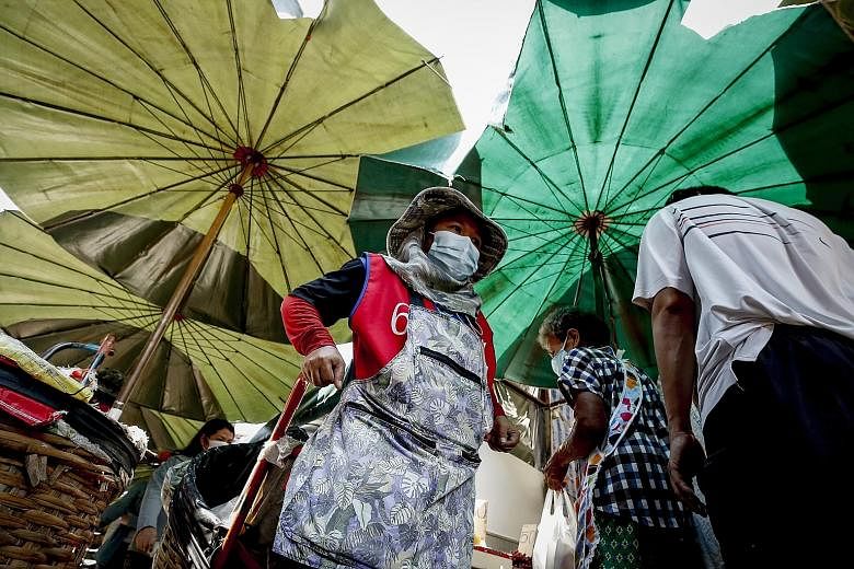 A wet market in the Thai capital Bangkok. Investment managers see emerging market equities, which have been under pressure during the pandemic-hit 2020, picking up strongly this year. This includes most South-east Asian and East Asian markets, which 
