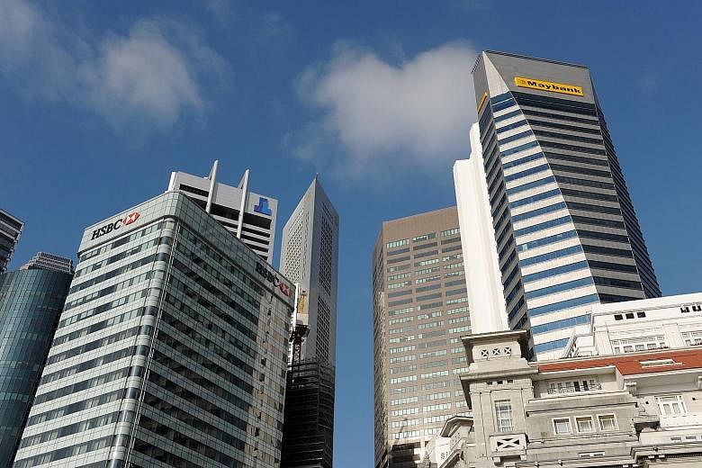 HSBC and Maybank's insurance venture Etiqa are among shortlisted bidders for AXA's business in Singapore, said people familiar with the matter.