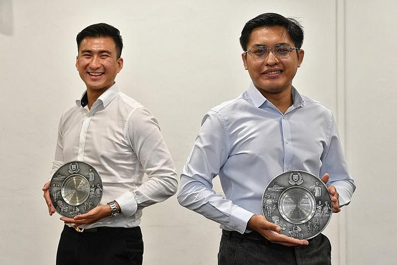 Mr Clement Tan (far left) and Mr Muhammad Mu'tasim Kassim helped to subdue a passenger who was assaulting a bus driver in September last year.