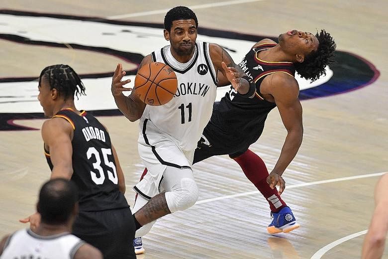 Kyrie Irving running into Cleveland's Collin Sexton. Sexton's three-pointer forced a second overtime, when he scored 15 of his career-high 42 points.