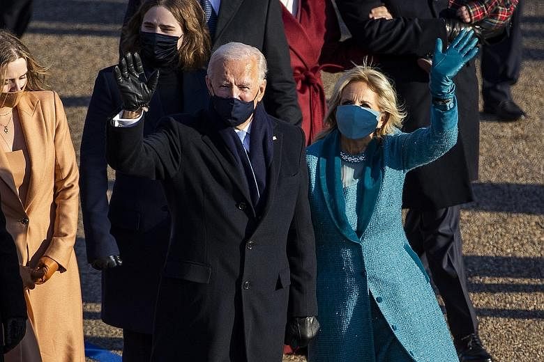 United States President Joe Biden and his wife Jill walking down Pennsylvania Avenue after his inauguration ceremony at the Capitol on Wednesday. The big question that the rest of the world, including Asia, faces with Mr Biden's inauguration, is whet