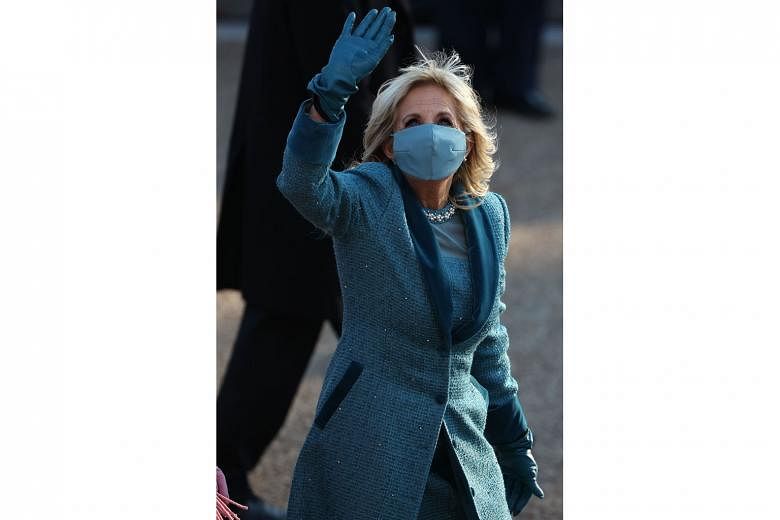First Lady Jill Biden greeting people after the inauguration. Dr Biden, who has a doctorate in educational leadership, will continue teaching writing at Northern Virginia Community College, where she taught full time as second lady previously. PHOTO:
