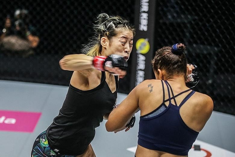 China's Meng Bo on the way to beating Brazilian Samara Santos via a unanimous decision in their One: Unbreakable catch weight (54.8kg) bout at the Singapore Indoor Stadium last night.