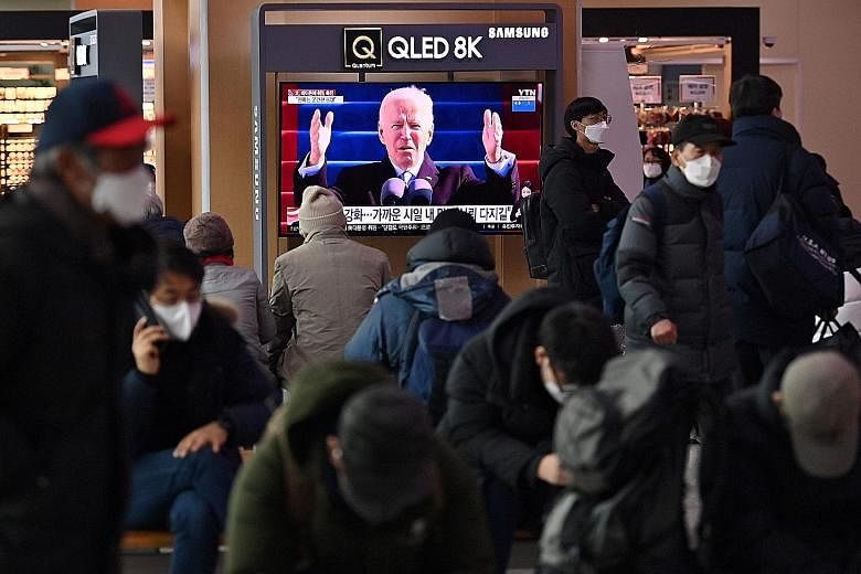 A television news programme in Seoul on Thursday on the inauguration of US President Joe Biden. South Korean President Moon Jae-in was effusive in his congratulatory message to Mr Biden.