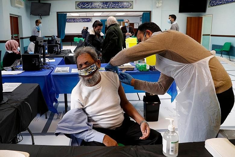 A man receiving Covid-19 vaccination at a temporary vaccination centre in Birmingham, central England, on Thursday. While many of these vaccines are proving miraculous in their efficacy, they risk exacerbating pre-existing geopolitical frictions and 