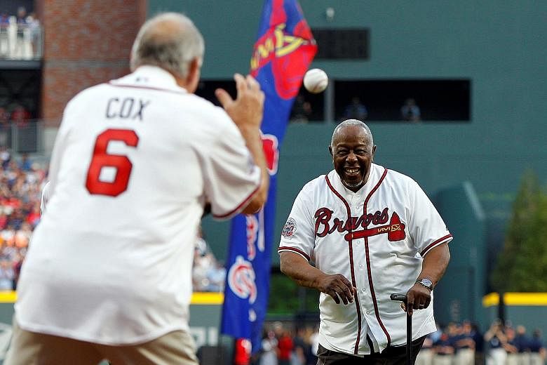 Major League Baseball Hall of Famer Hank Aaron throwing the ceremonial first pitch in 2017. He held the career home-run record of 755 for 33 years until Barry Bonds broke it in 2007.