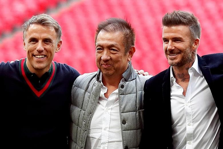 Phil Neville (left) and David Beckham, pictured with Singaporean businessman Peter Lim, are reunited at MLS team Inter Miami. PHOTO: REUTERS