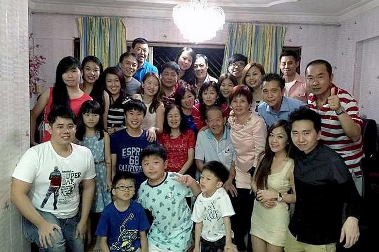 Above: Hair salon owner Elsa Lim (in black and white top) and her family during a Chinese New Year gathering in 2016. She says that this year, instead of physical visits, they would make do with phone or Zoom calls. PHOTO: COURTESY OF ELSA LIM Right: