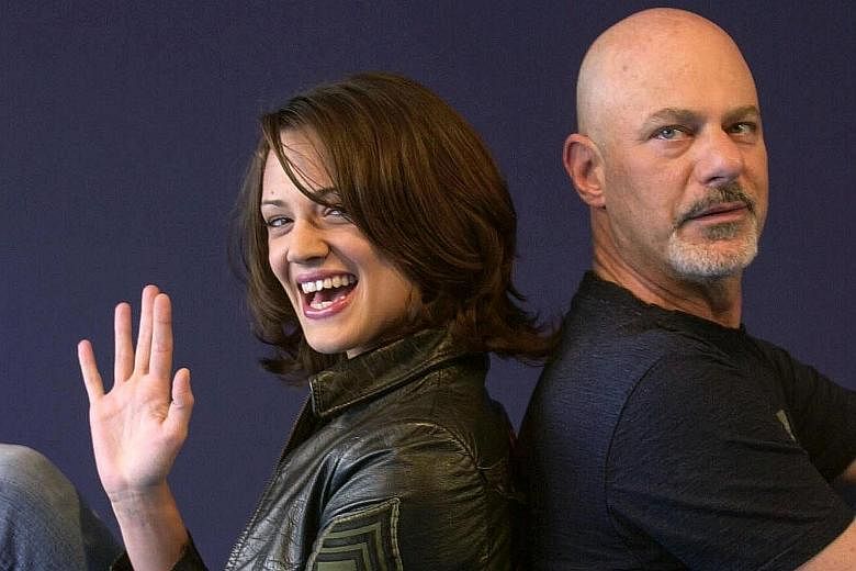 Italian actress Asia Argento with American director Rob Cohen in a 2002 file photograph, during the 28th American Film Festival of Deauville before the screening of Cohen's film, xXx.