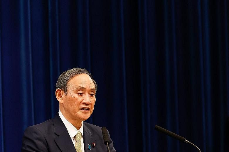 Japanese Prime Minister Yoshihide Suga speaking at a press conference earlier this month, where he announced that additional prefectures would go under a state of emergency amid a surge in Covid-19 cases. His leadership will be put to the test when t