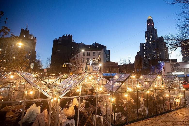 HOT DINING: Greenhouses, located in a park in front of HotHouse Fort Greene, are used for outdoor dining in Brooklyn. The restaurant plans to construct seven more. With dining and safe-distancing restrictions in place to reduce the spread of the coro