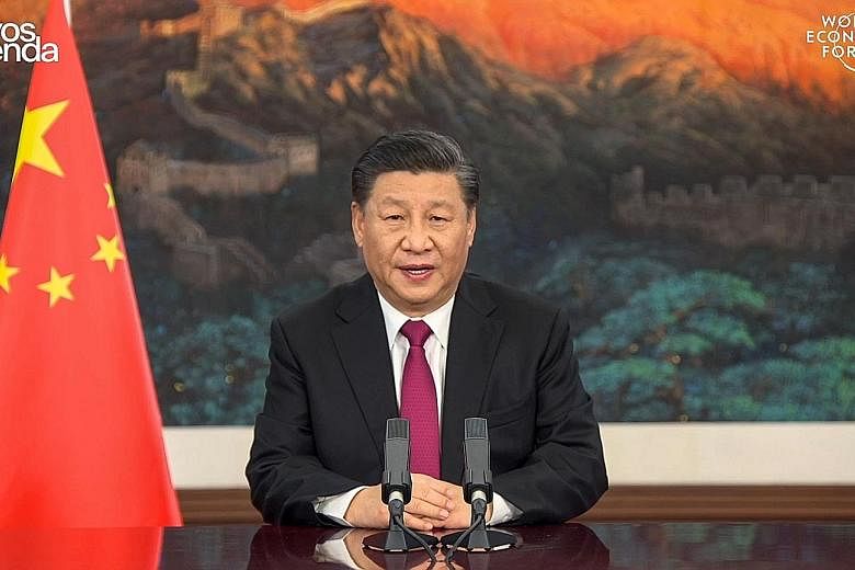 Chinese President Xi Jinping delivering a special address yesterday at the World Economic Forum's The Davos Agenda, where he touched on issues such as the economic crisis and climate change.
