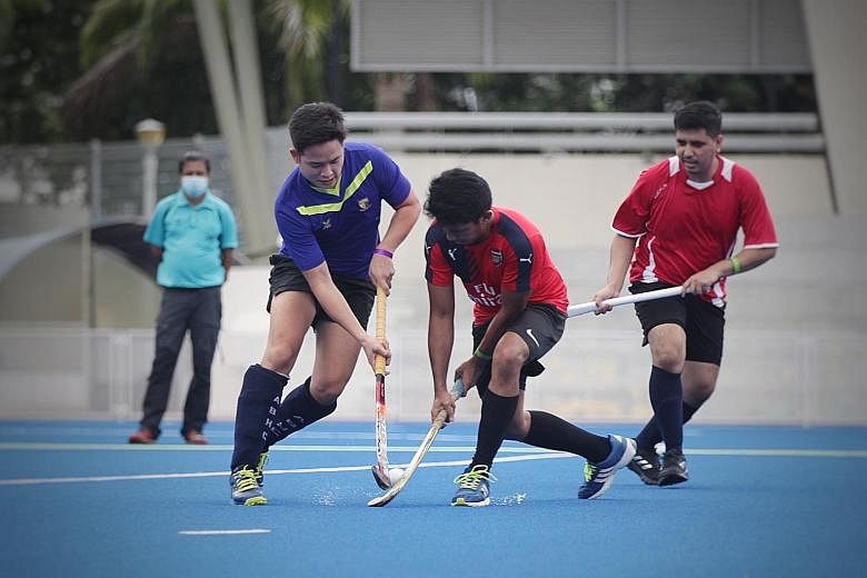 Oldham hockey player Mohamad Fahrul Saaid (in blue) playing in a 3v3 hockey game as part of a trial for the upcoming league, which will begin with the Under-19s on Saturday.