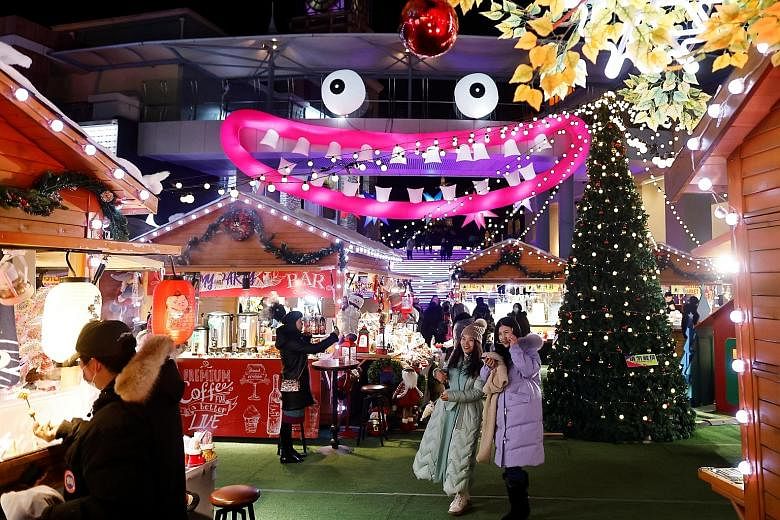 A Christmas market at a mall in the Chinese capital Beijing last month. BlackRock managing director and chief investment strategist for Asia-Pacific Ben Powell expects China's economic growth to be appreciably above the 7 per cent trend, noting that 