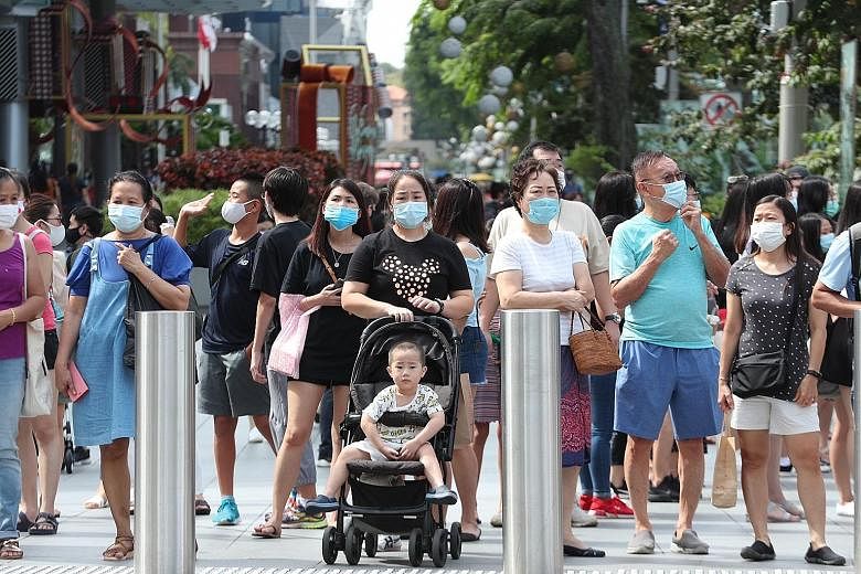 Wearing masks outdoors (above) and observing safe distancing are among the practices that many Singapore residents will keep to when the Covid-19 pandemic is over, according to a nationwide online study conducted last month by Nanyang Technological U