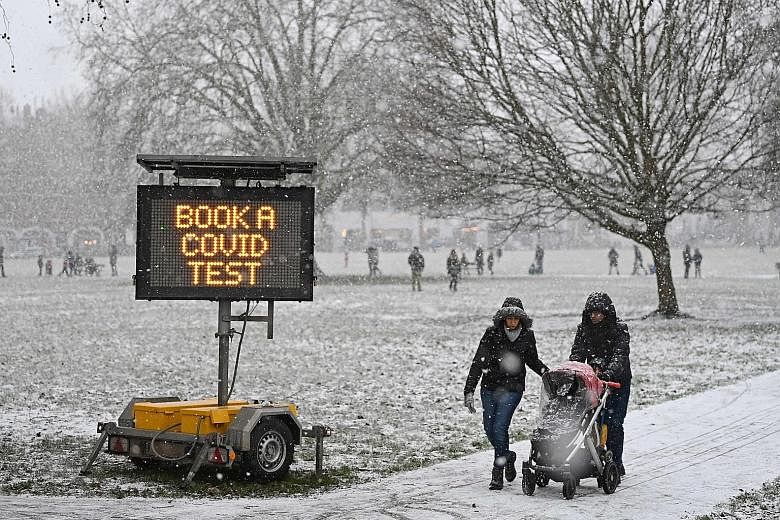 Rare snowfall in London on Sunday, amid the coronavirus pandemic. Almost 3.7 million people in Britain have tested positive for the virus, the fifth-largest caseload worldwide.
