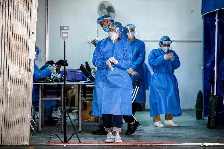 A coronavirus testing centre in Hong Kong. The city will not start vaccinating its citizens until the end of next month at the earliest. It may also not vaccinate all elderly citizens and those in nursing homes at once.