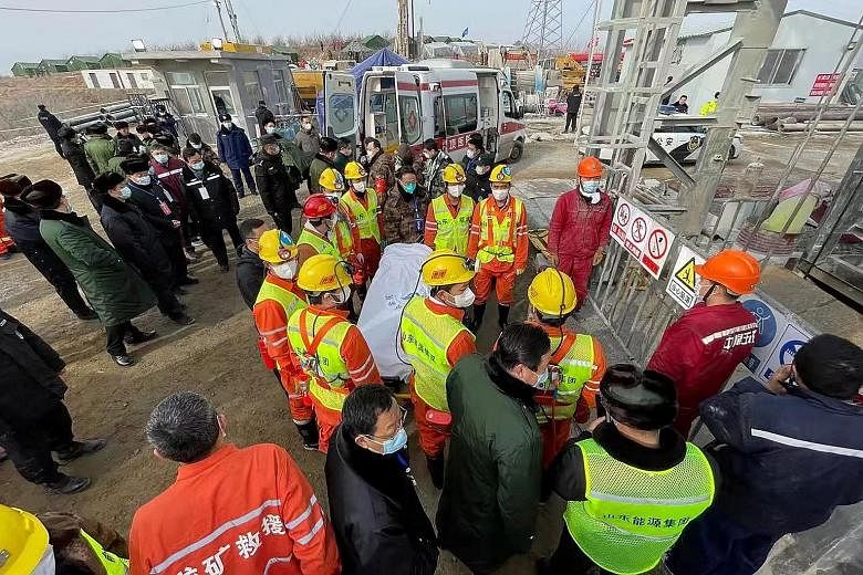 Rescuers carrying a miner on a stretcher at the gold mine in Qixia, China's Shandong province, after he was saved on Jan 24 - two weeks after a mine shaft collapsed, trapping him and 21 others. Local officials sat on the news for nearly 30 hours befo