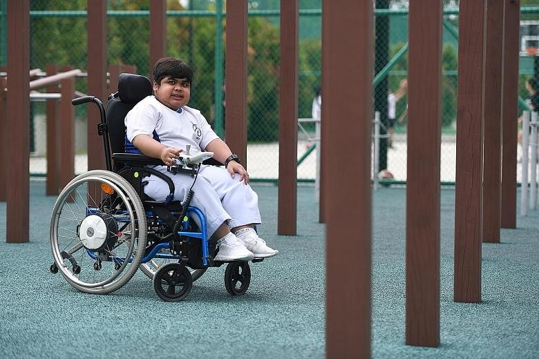 Naufal Dzareef Azahar, 16, who has muscular dystrophy and uses a wheelchair, has been able to move around Kranji Secondary School independently since renovations to its premises were completed in 2019.