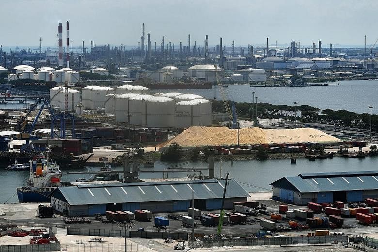 Cement and petrochemical facilities at Jurong Port and Jurong Island. Minister for Sustainability and the Environment Grace Fu said Singapore's carbon tax is central to its climate change mitigation strategy, and businesses and households will get su