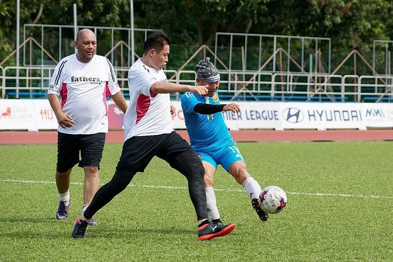 Amateur footballers playing in a friendly match organised by the Football Association of Singapore. Being able to have a kick about has become increasingly difficult for weekend warriors.