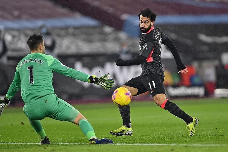 Liverpool's Mohamed Salah scoring his second goal in their 3-1 win over West Ham on Sunday. The Egypt forward is now the first Reds player to score at least 20 goals in four straight seasons since Ian Rush.