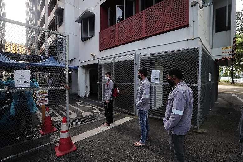 Vaccination will be made available to migrant workers in dormitories as part of the strategy to protect all Singaporeans and long-term pass holders here, said Second Minister for Manpower Tan See Leng. ST PHOTO: KELVIN CHNG
