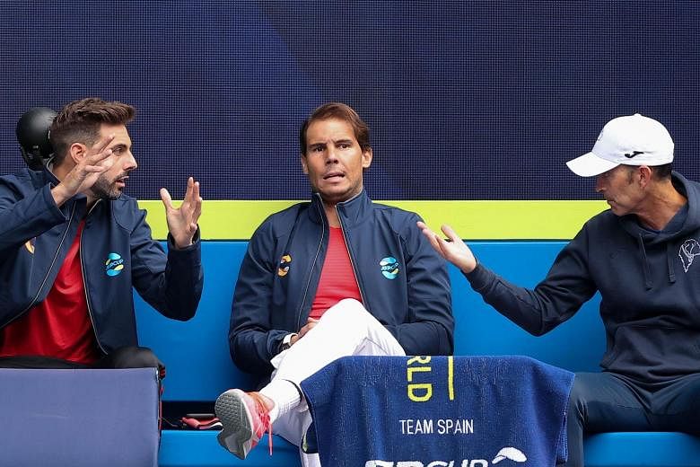 Spain's Rafael Nadal (centre) at the ATP Cup sidelines before the Group B match between teammate Pablo Carreno Busta and Australia's John Millman. Carreno Busta, who replaced the injured 20-time Major champion, won 6-2, 6-4.