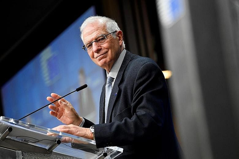 EU foreign policy chief Josep Borrell (left) says he will deliver "clear messages" to the Kremlin despite it ignoring Western calls to release Alexei Navalny, President Vladimir Putin's most prominent critic who was jailed earlier this week. PHOTO: E