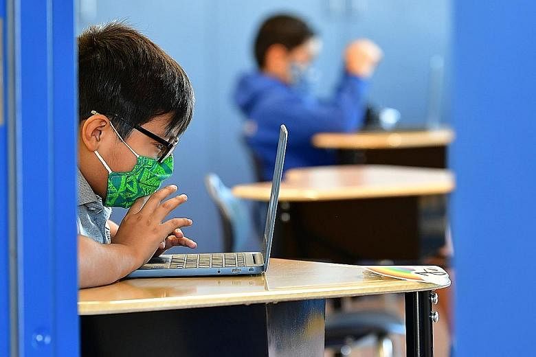 A quarter of Singapore parents surveyed said their children experienced cyber bullying last year, up from 16 per cent in 2019. PHOTO: AGENCE FRANCE-PRESSE