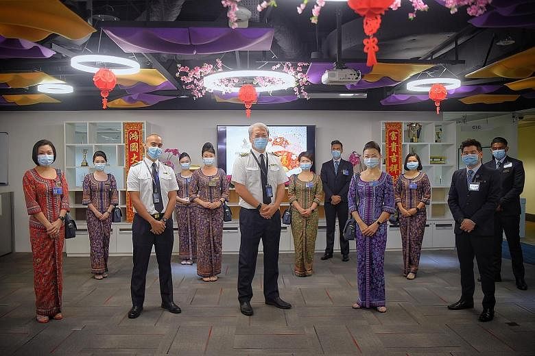 Flight SQ956 took off for Jakarta at 9.30am carrying a crew of 12 (left), and is the first of three departing SIA Group flights with crew who have received both doses of the Pfizer-BioNTech vaccine.