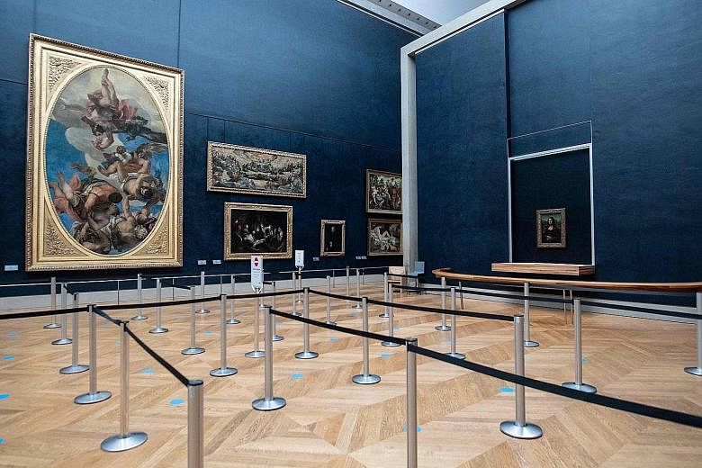 Leonardo da Vinci's Mona Lisa painting in an empty room at the Louvre Museum, which is closed due to the French government's measures to prevent the spread of the coronavirus.