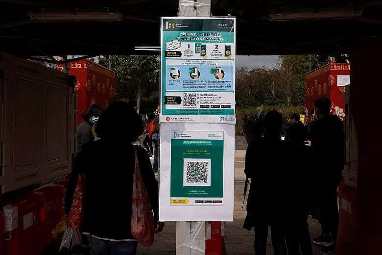 Hong Kong's easing of curbs on dine-in services will be contingent on all staff getting tested every 14 days and diners using the LeaveHomeSafe tracing app or having their data recorded.