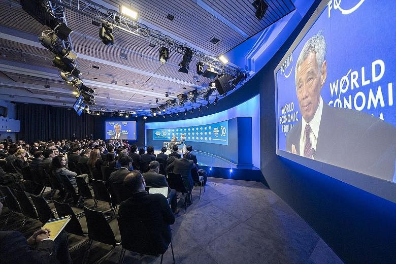 Prime Minister Lee Hsien Loong speaking on Jan 22 last year at the World Economic Forum's meeting in Davos, Switzerland. This year's forum, initially set to be held in Davos, was moved to Singapore because of the perceived Covid-19 risks of hosting t