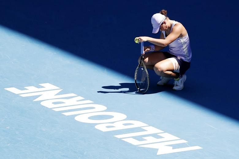 Australia's Ashleigh Barty is dejected after losing to Czech Karolina Muchova (above) yesterday in the Australian Open quarter-finals in Melbourne.