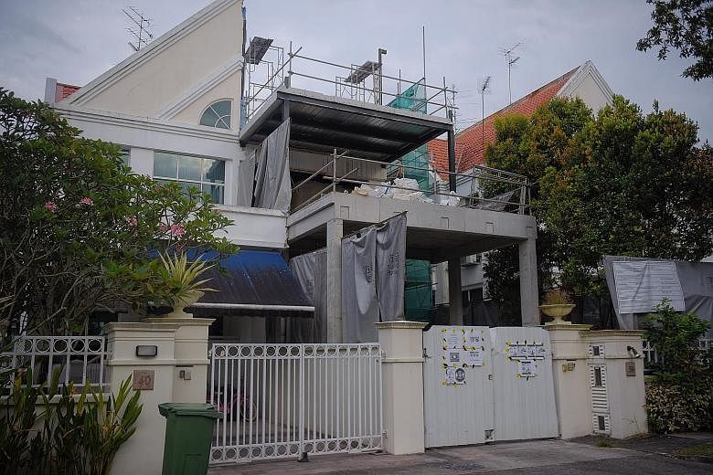 The 53-year-old Singapore permanent resident was overseeing construction work at the two-storey house (right) at 38 University Walk, near Dunearn Road, when he fell through an opening in the floor and landed on a staircase 4.7m below.