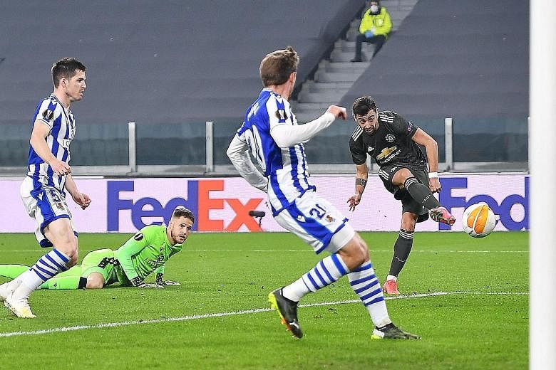 Manchester United's Bruno Fernandes scoring the opening goal in the Europa League last-32, first-leg match against Real Sociedad at the Allianz Stadium in Turin, Italy.