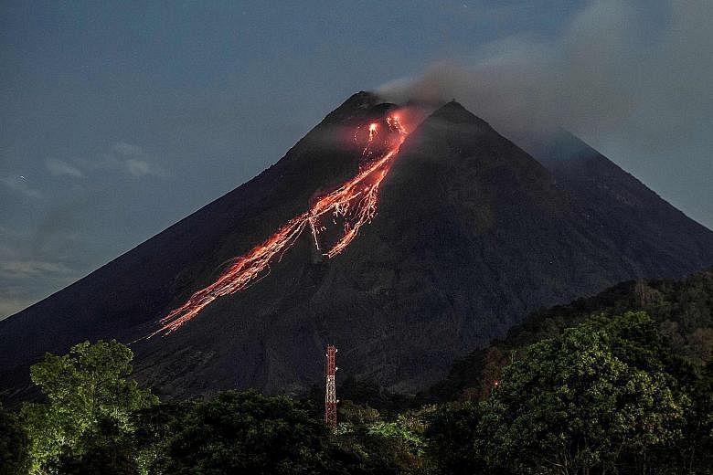 Red-hot lava flowing down from the crater of Mount Merapi as seen from Kaliurang, in Yogyakarta, yesterday. Residents near the volcano, which has been erupting sporadically since January, have been warned to avoid the area within a 5km radius of the 
