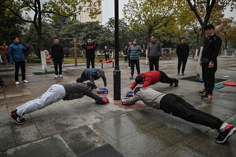Seniors exercising at a park in Wuhan in China's central Hubei province. The number of China's oldest old - those aged 80 and above - is rising faster than that of elderly Chinese as a whole. This has both health and social implications affecting the