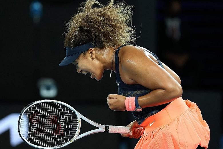 Japan's Naomi Osaka celebrating after winning a point against Jennifer Brady in yesterday's Australian Open final. She won 69 points compared to the American's 54.